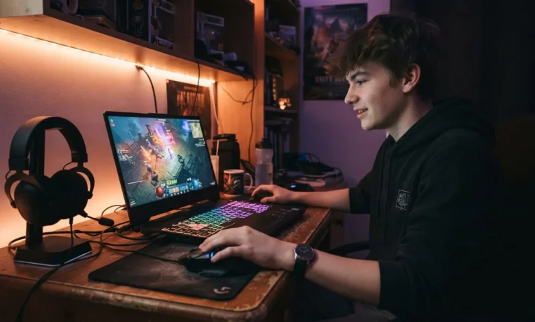 Acer Gaming Laptop Guide: Predator vs Nitro 2026 1 Gamer using an Acer Nitro gaming laptop with RGB keyboard lighting in a home setup