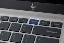 Snipping Tool window on HP laptop showing New button, snip mode options, and edit toolbar with pen and highlighter