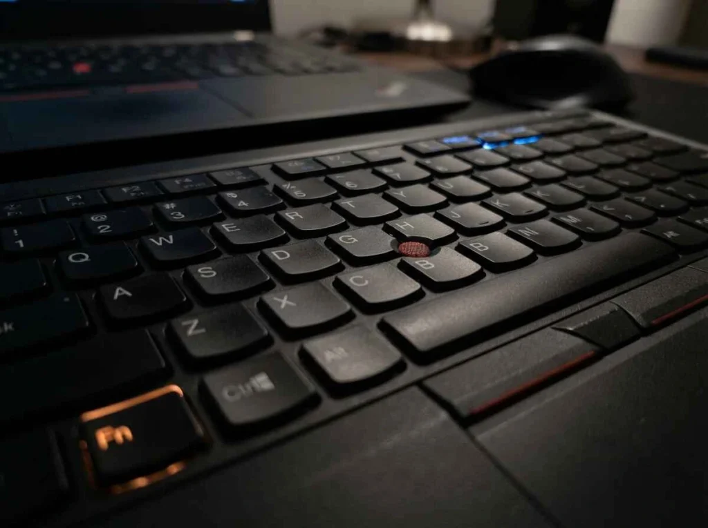 How To Screenshot On A Lenovo Laptop 2 Close-up of a Lenovo ThinkPad keyboard showing the Fn key and PrtScn key needed to take a screenshot Sab kuch article file me bhi save kar diya hai (image list ke neeche).