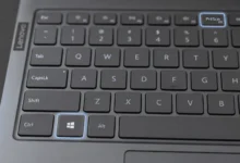 Close-up of Lenovo laptop keyboard highlighting the Windows key and PrtScn key used to screenshot
