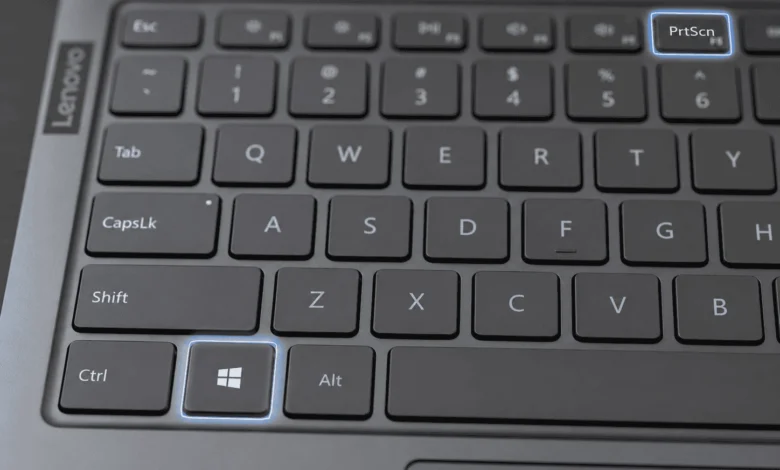 How To Screenshot On A Lenovo Laptop 1 Close-up of Lenovo laptop keyboard highlighting the Windows key and PrtScn key used to screenshot
