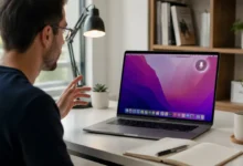 Person using dictation on Mac while speaking to a MacBook at a desk